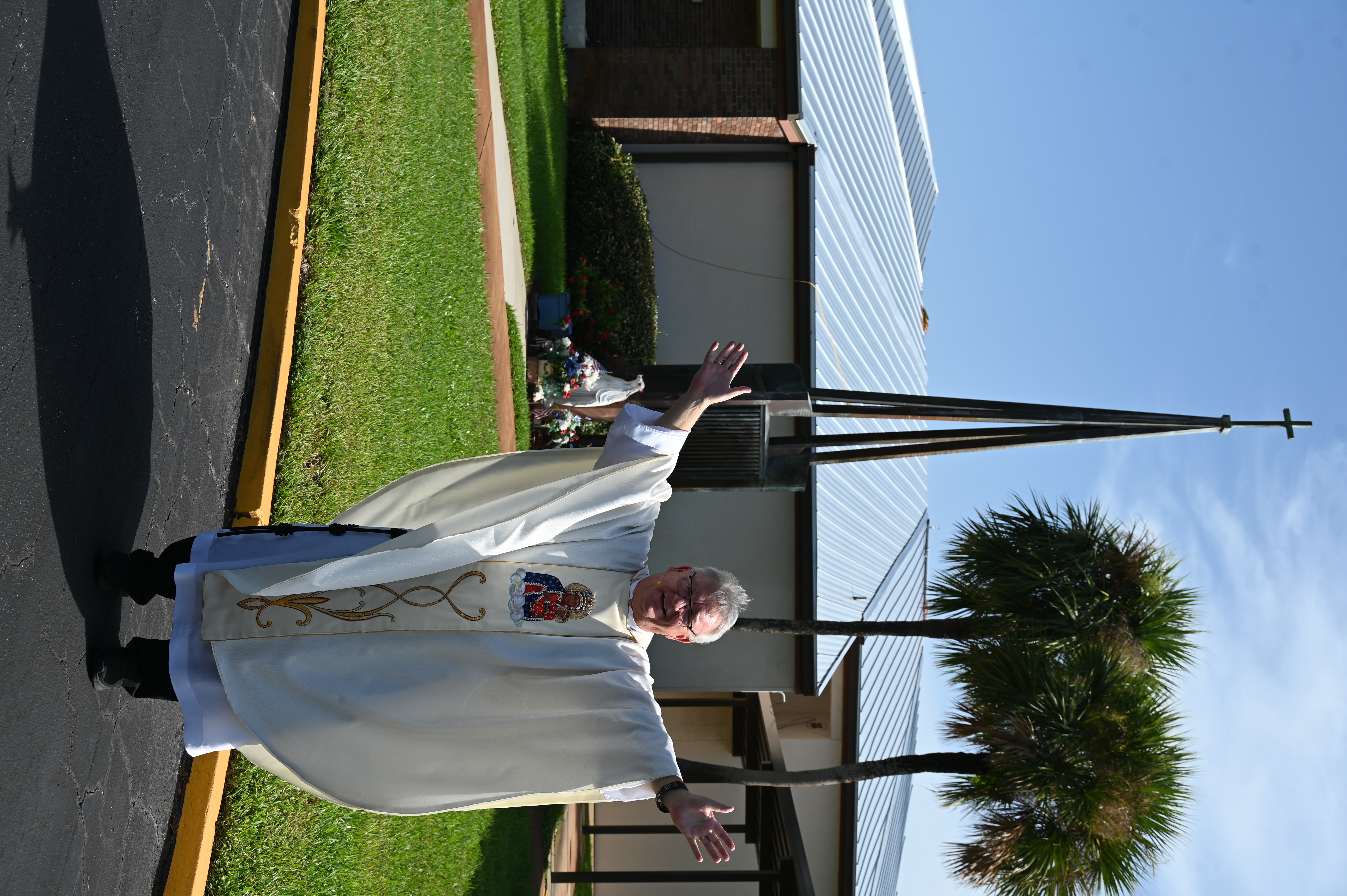 Fr. Chris in front of the church